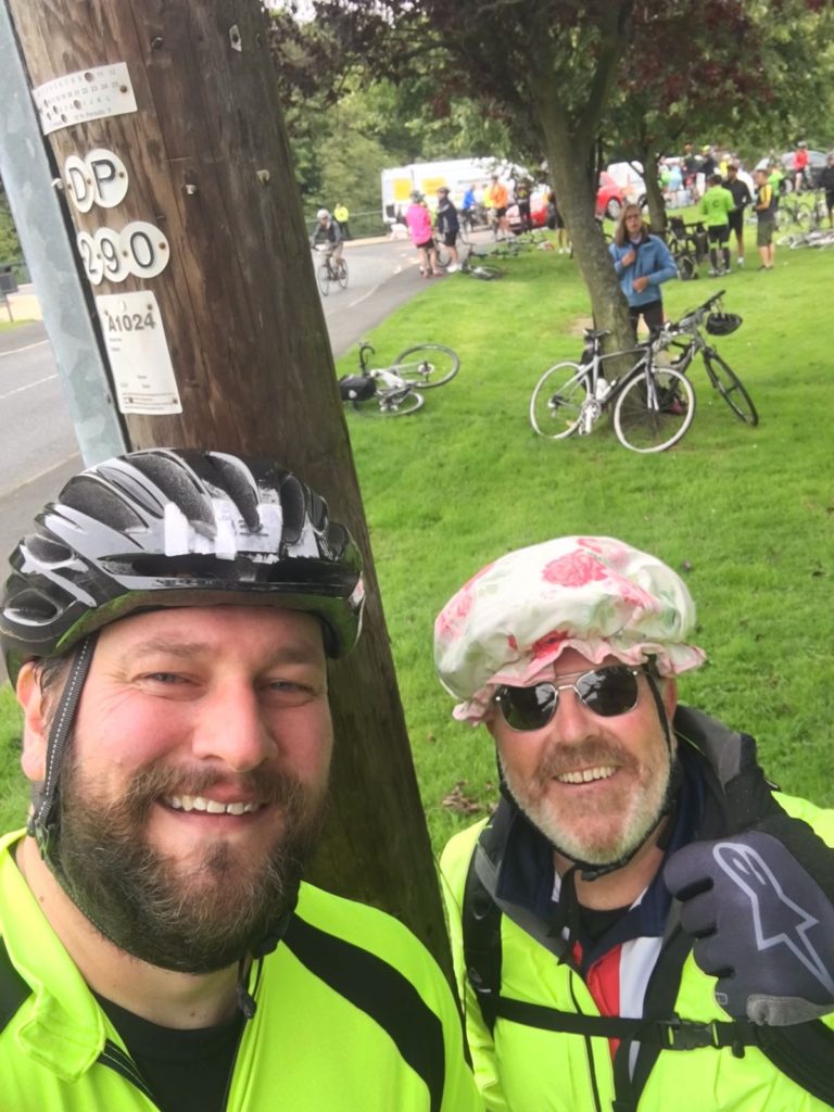 The author and Adam taking a short break during the 2018 Great North Ride Sportive.  There are other bikes and cyclists in the background