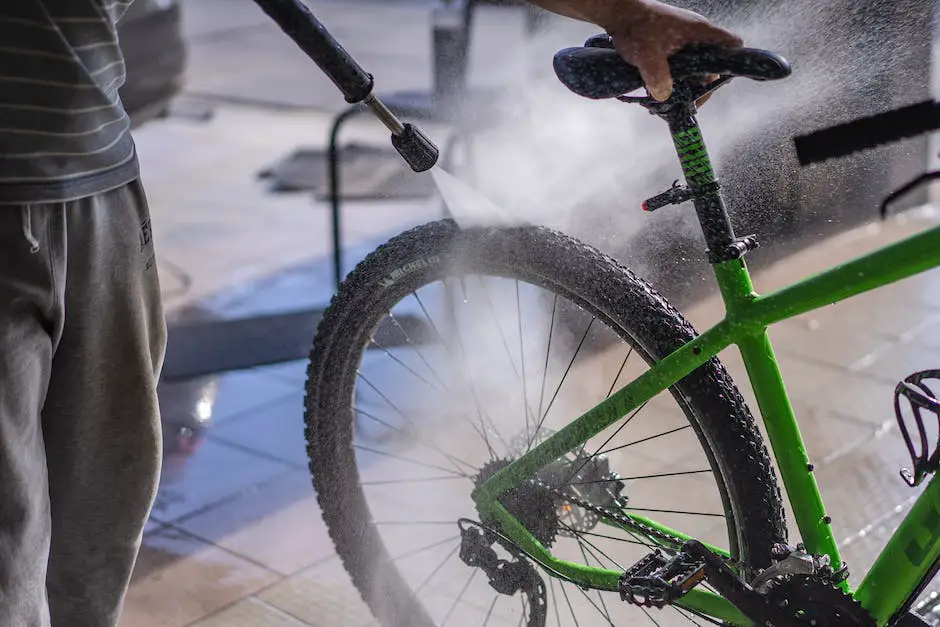 A person washing their bike with a sponge and cleaning solution