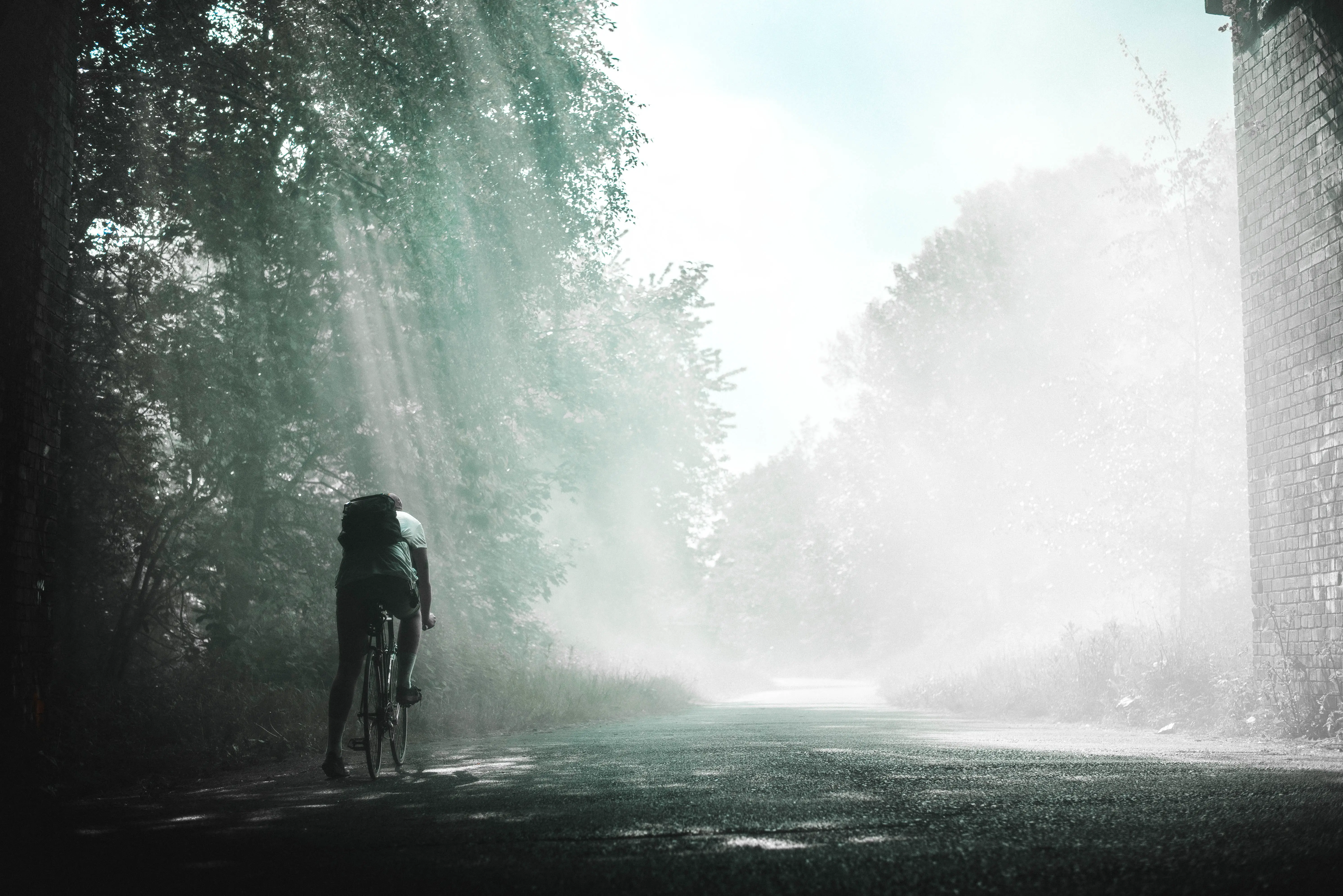 An image of a person cycling on a road with proper posture and form.