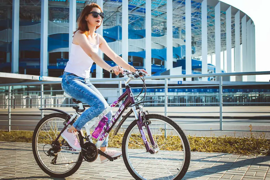 An image with a person in casual cycling clothes riding a bicycle on a bike path.